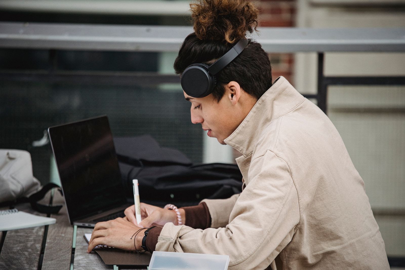 Headphones and a microphone representing passive and active listening